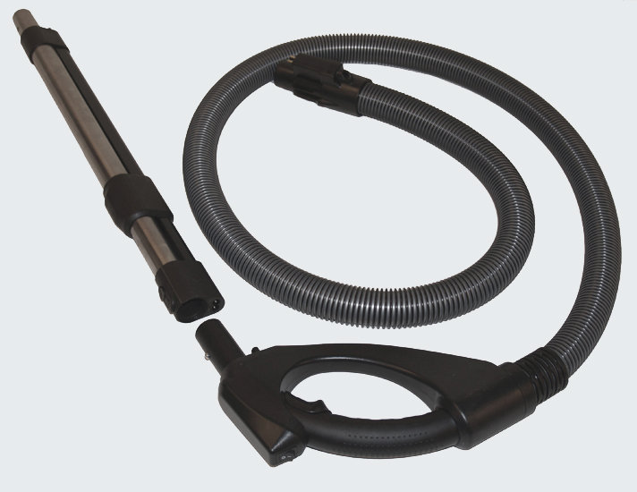 Speciální teleskopická tyč a hadice pro připojení klepací hlavy k vysavači.